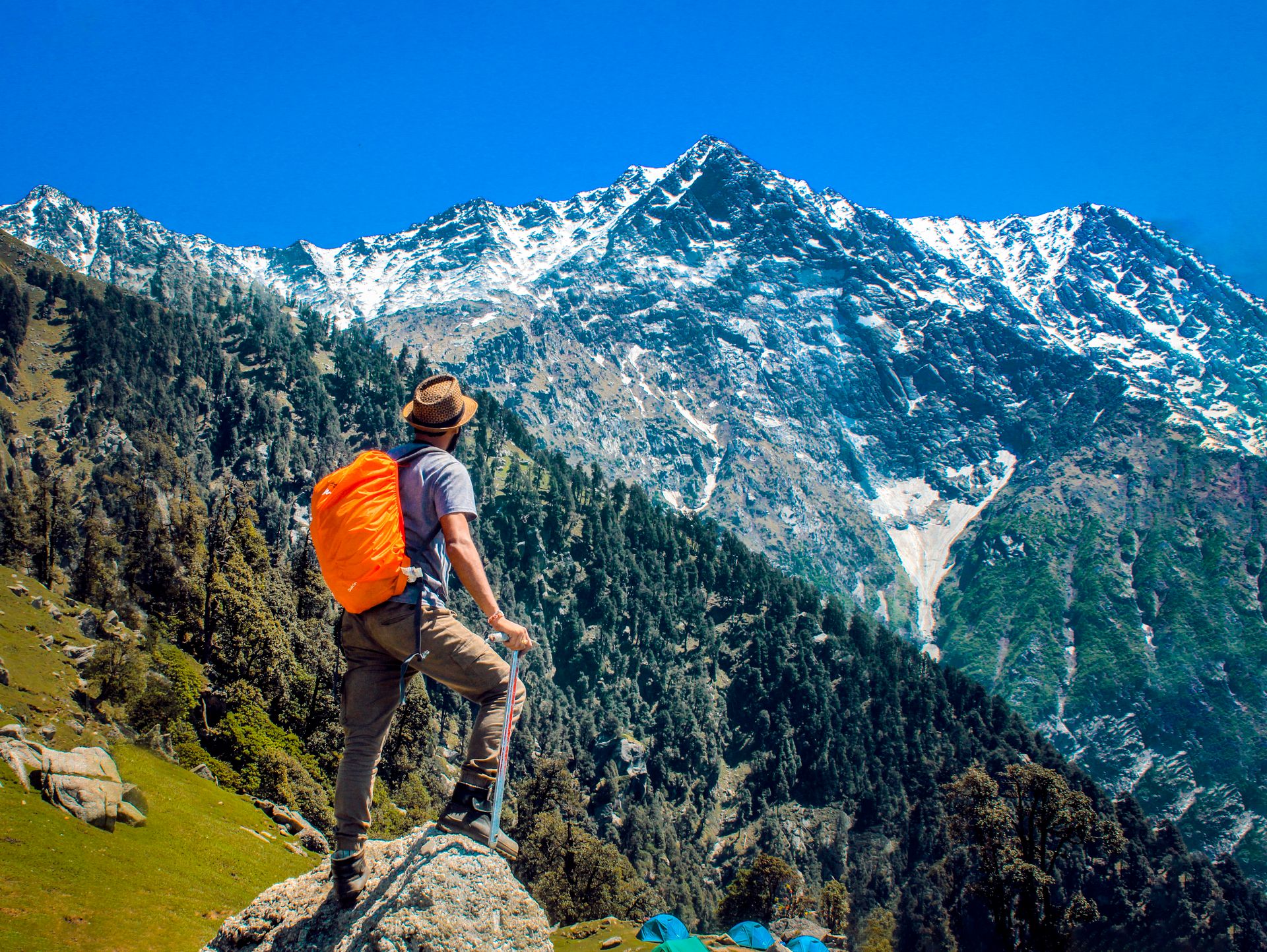 Hikers trekking through a mountain valley